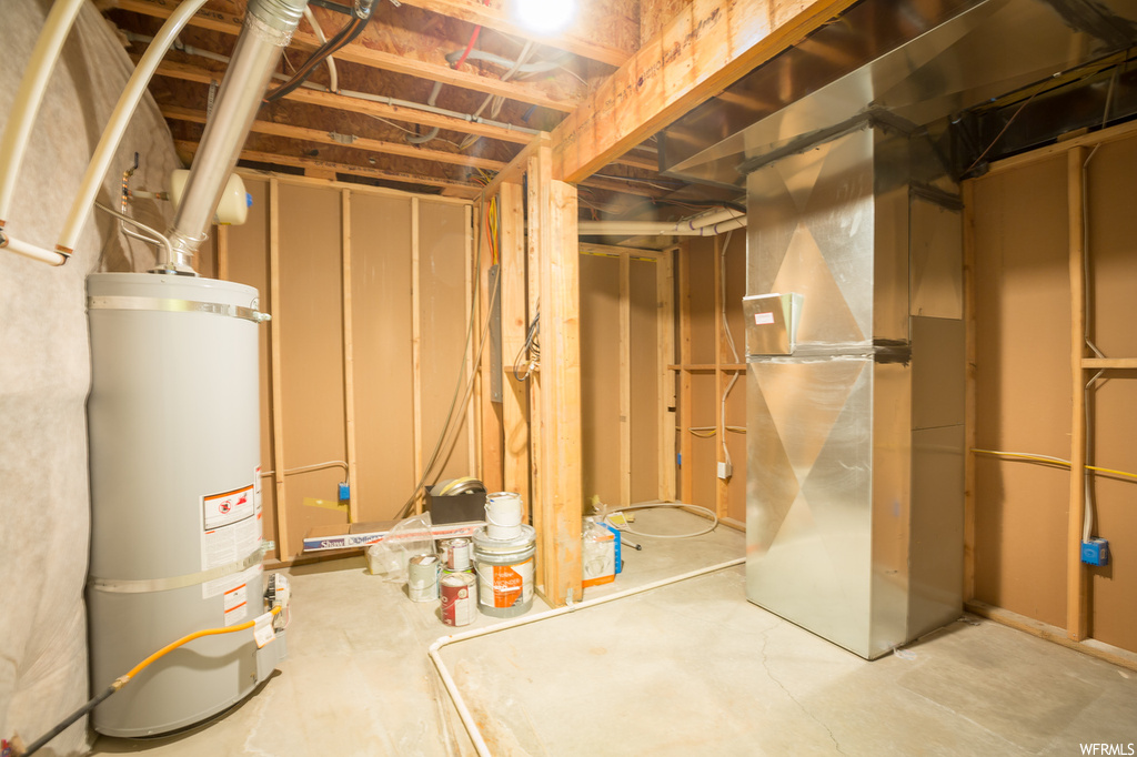 Basement with strapped water heater
