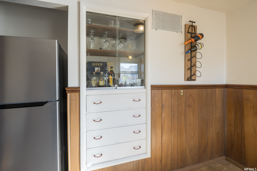 Details featuring stainless steel refrigerator and bar
