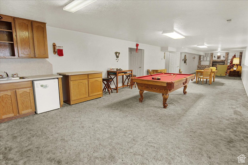 Game room featuring light carpet, sink, and pool table