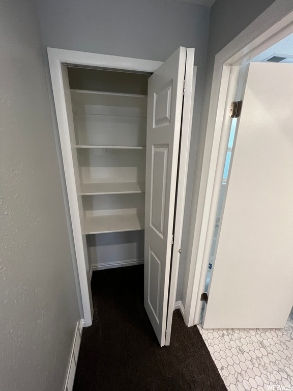 Closet featuring a baseboard heating unit