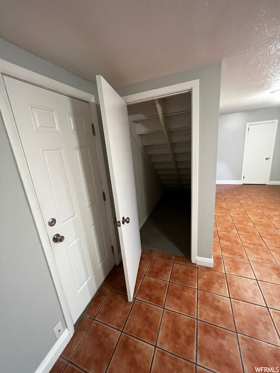 Corridor with tile flooring