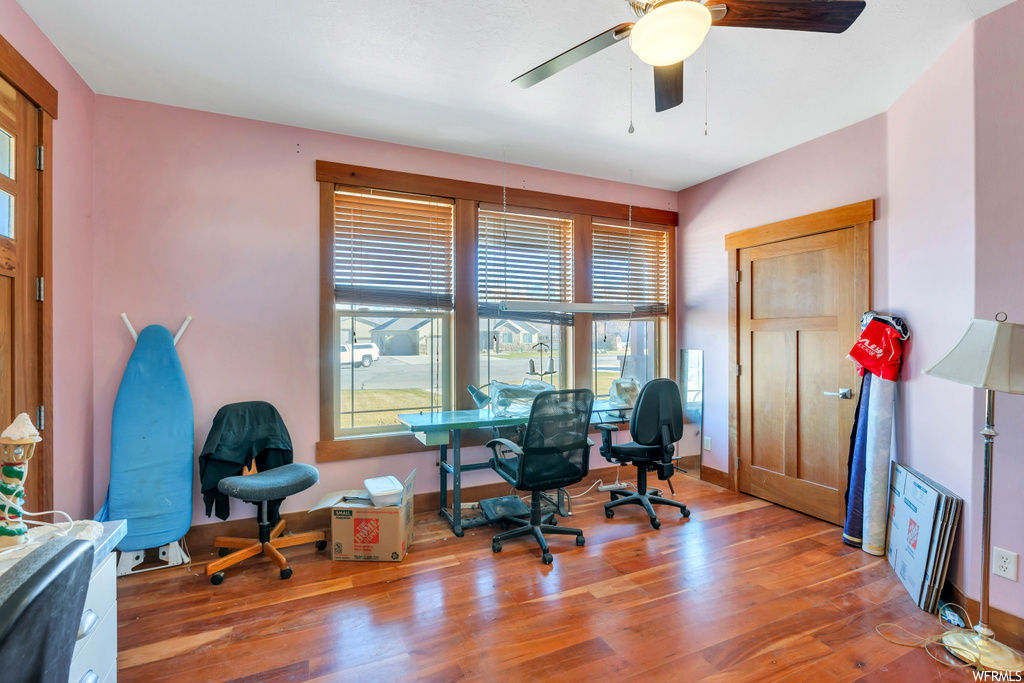 Office space featuring ceiling fan and hardwood / wood-style floors