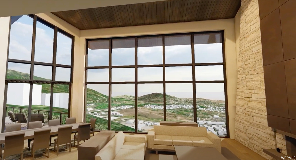 Interior space with wood ceiling and a mountain view