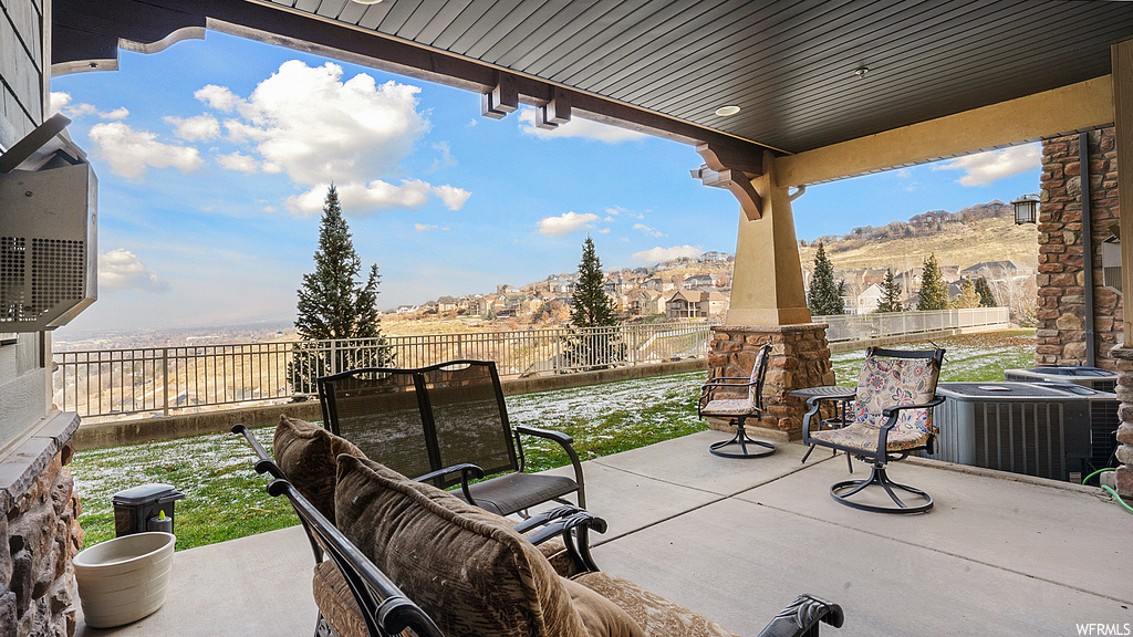 View of patio / terrace featuring an outdoor living space and central AC unit