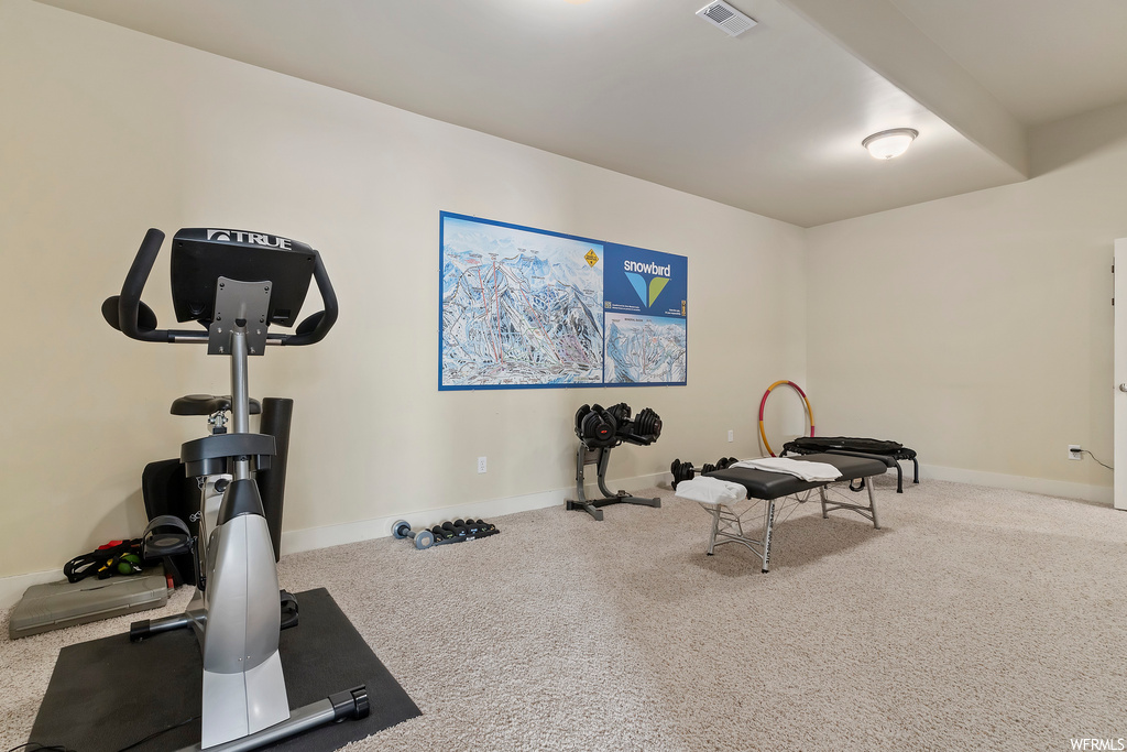 Exercise room with carpet flooring