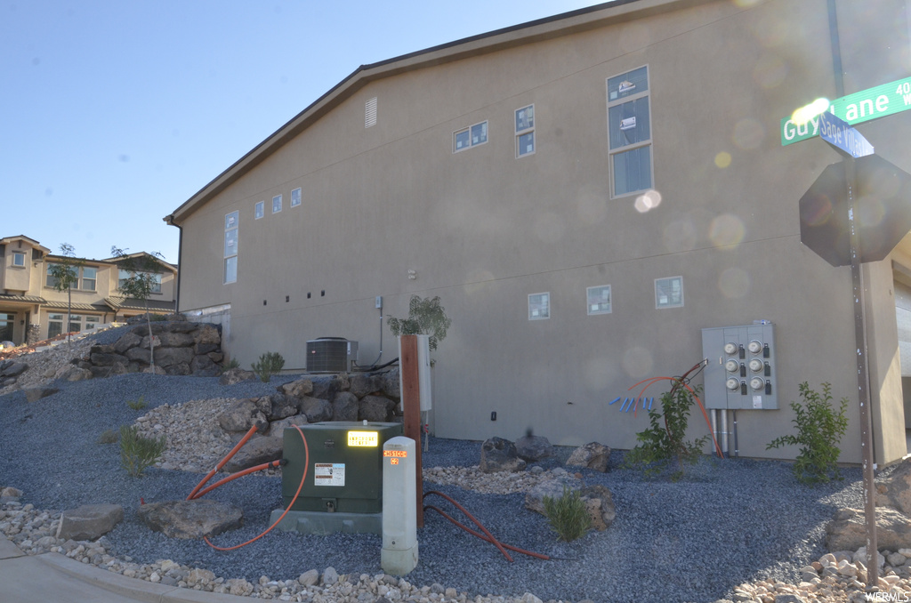 View of home's exterior with central air condition unit