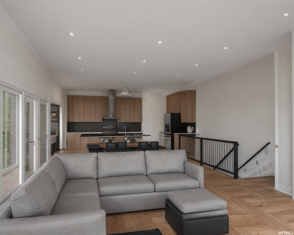 Living room featuring light parquet flooring