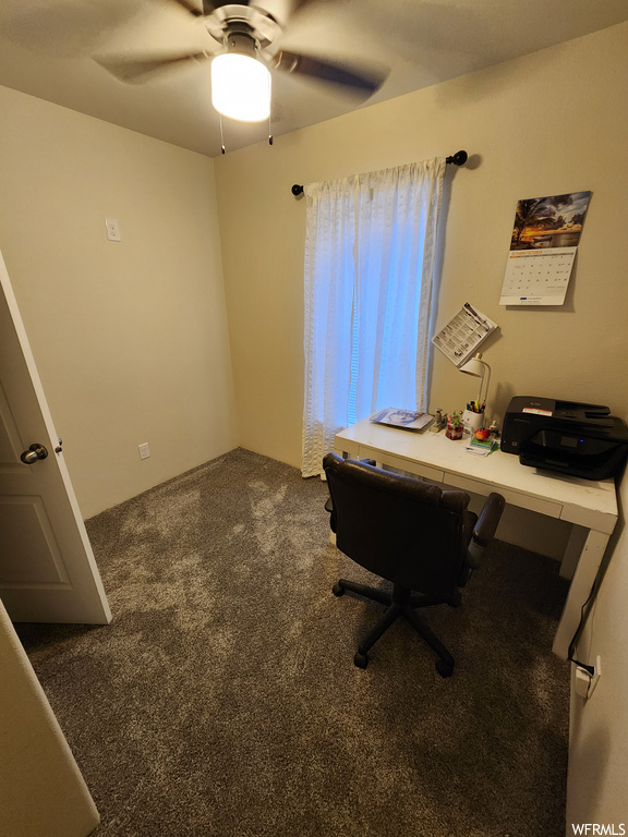 Office space with ceiling fan and carpet floors