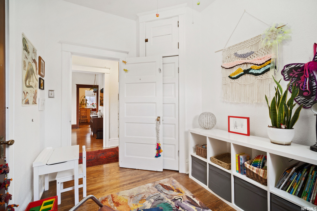 Playroom with light hardwood / wood-style flooring