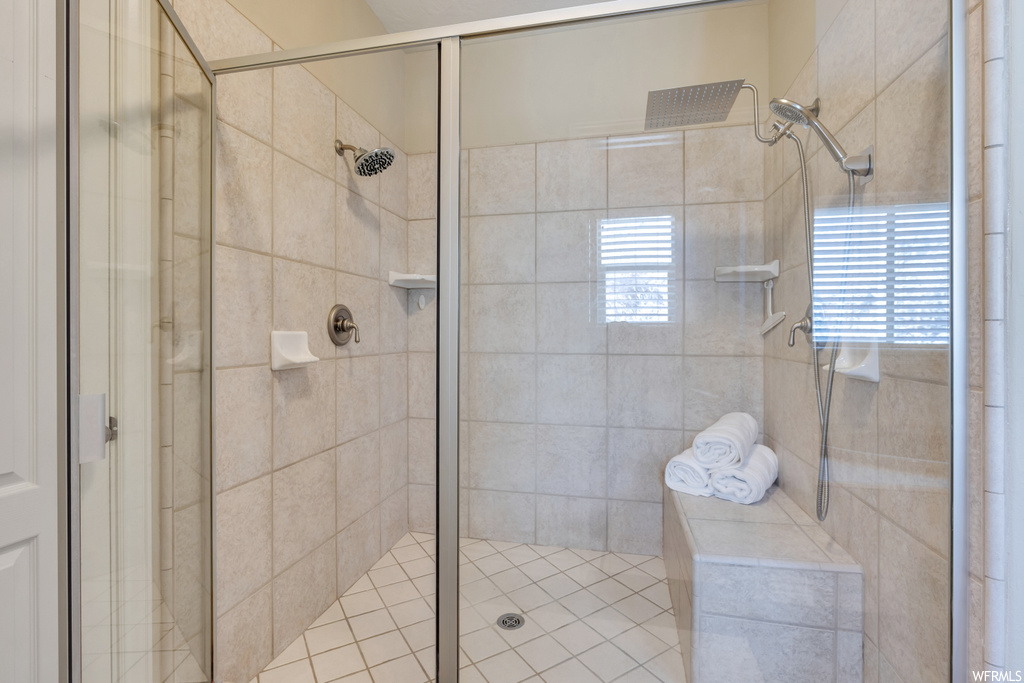 Bathroom with a shower with shower door