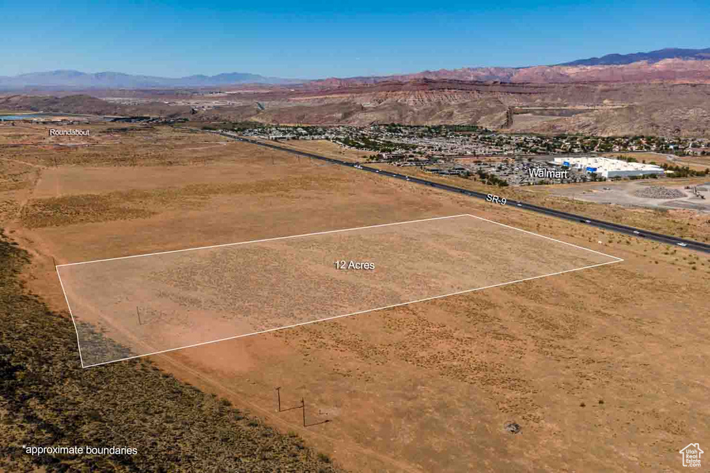 Birds eye view of property featuring a mountain view