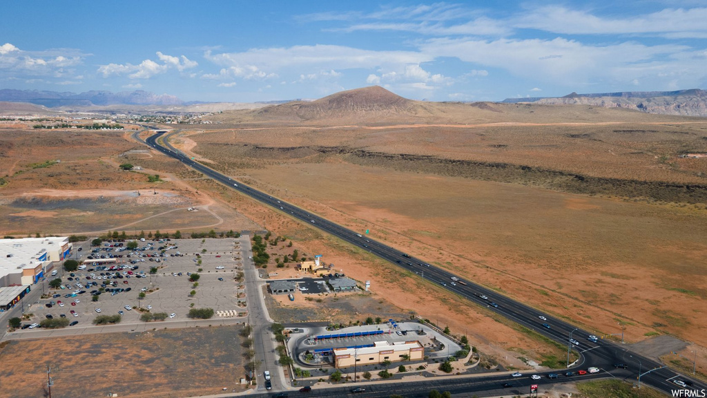 Birds eye view of property with a mountain view