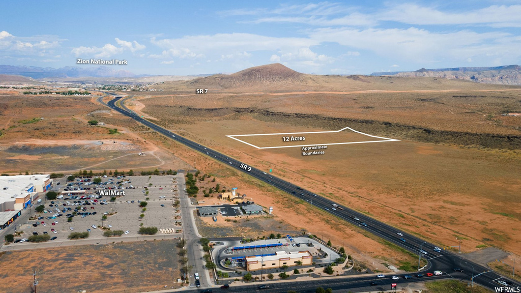 Birds eye view of property with a mountain view