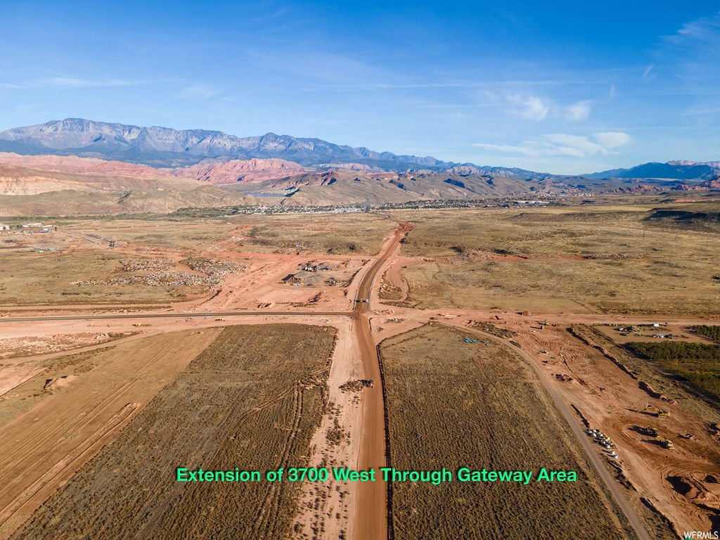 Aerial view featuring a rural view and a mountain view