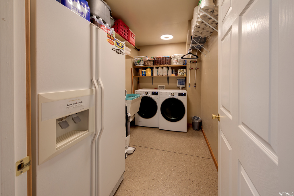 Laundry area with washer hookup and washing machine and dryer