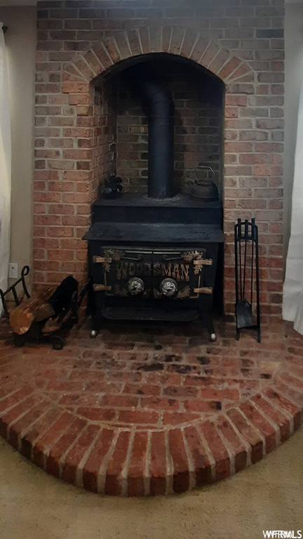 Room details featuring a wood stove
