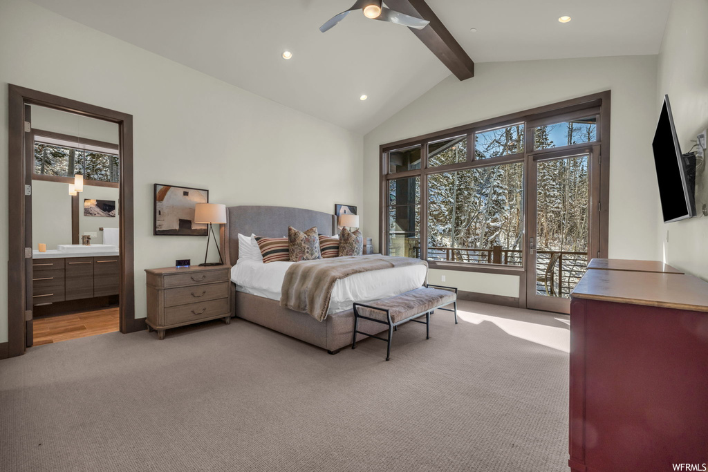 Carpeted bedroom with vaulted ceiling with beams, multiple windows, ceiling fan, and access to exterior