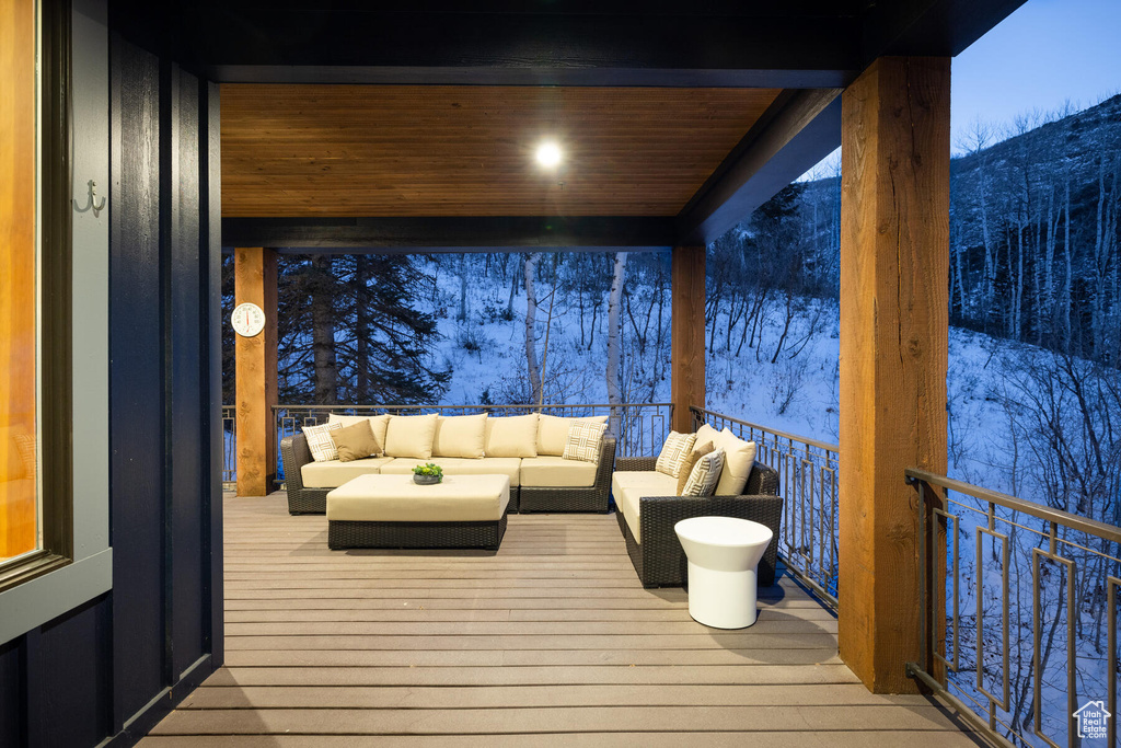 Snow covered deck with an outdoor hangout area