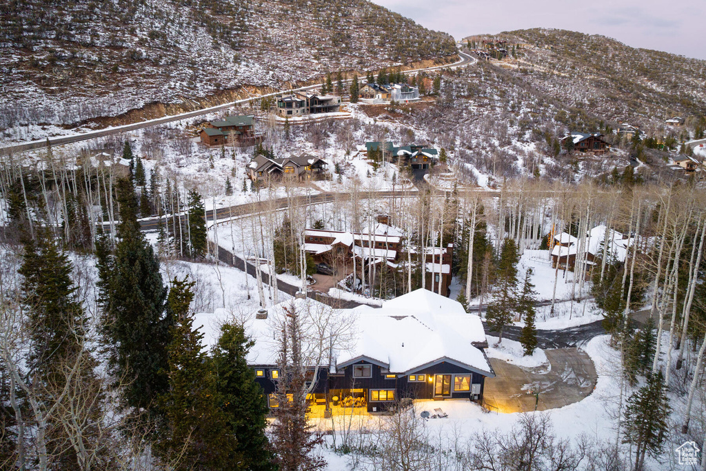 Snowy aerial view featuring a mountain view