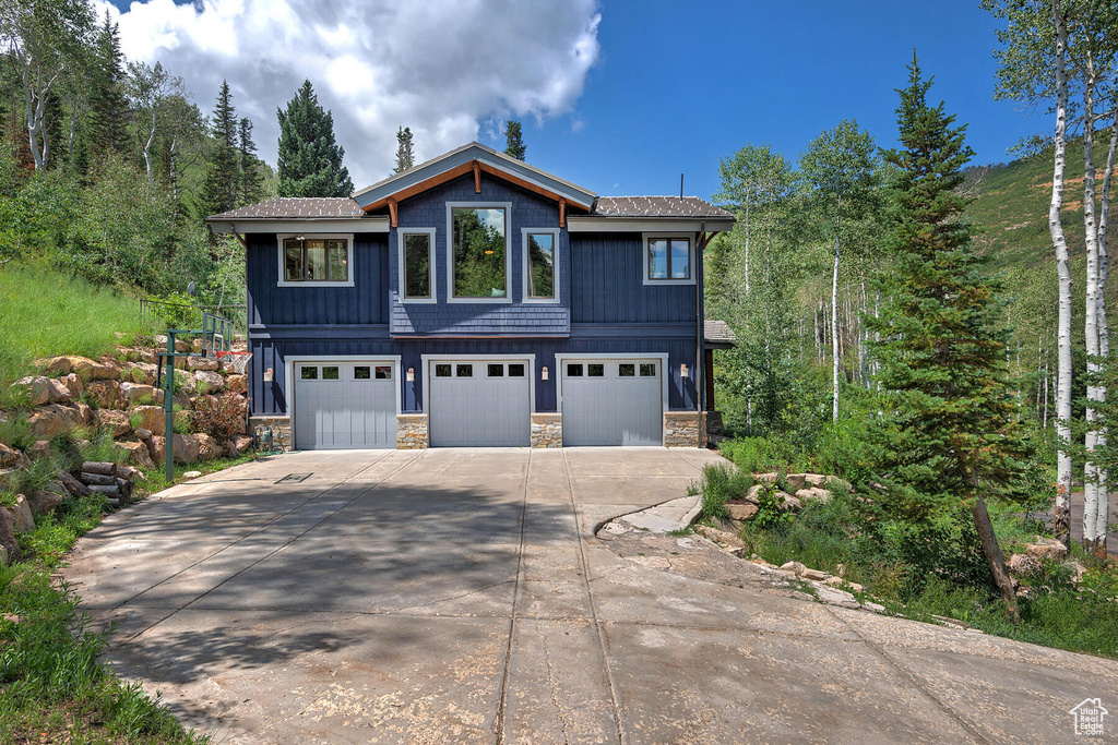 View of front of property featuring a garage