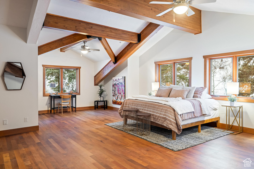 Bedroom featuring high vaulted ceiling, hardwood / wood-style floors, ceiling fan, and beam ceiling