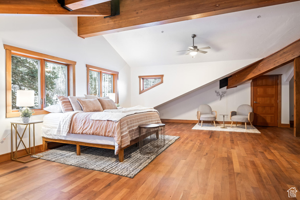 Bedroom featuring ceiling fan, beam ceiling, high vaulted ceiling, and wood-type flooring