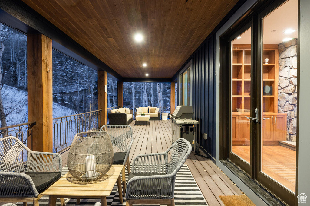 Sunroom with wood ceiling