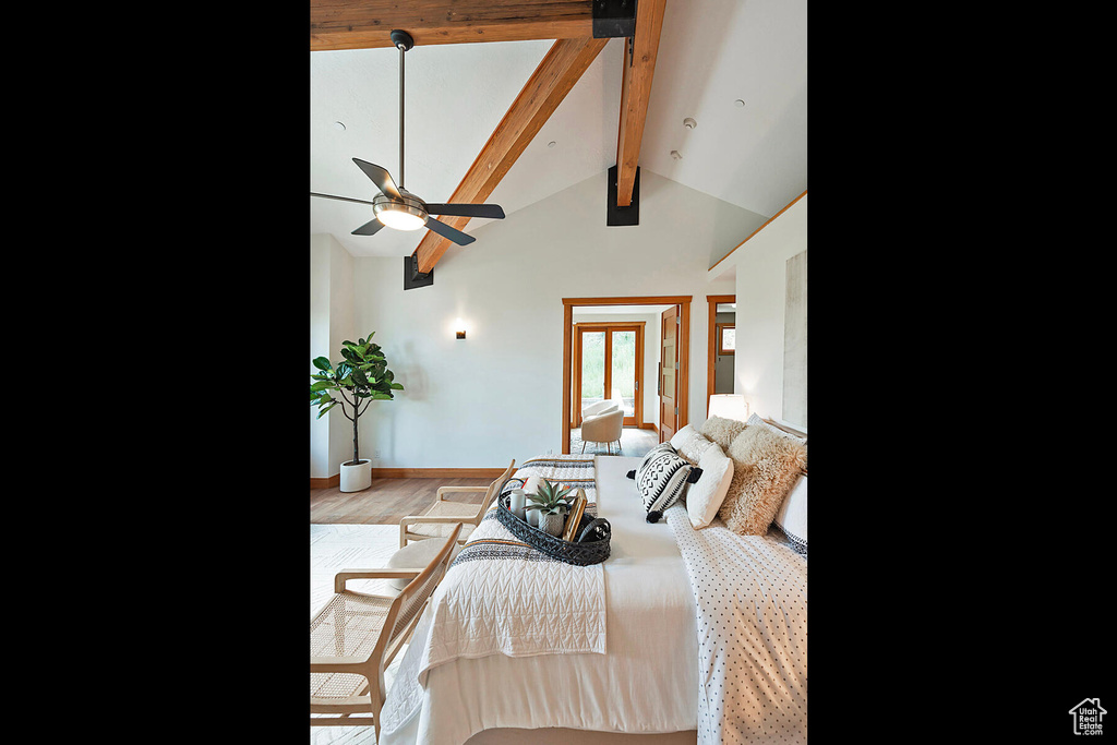 Bedroom featuring high vaulted ceiling, beam ceiling, hardwood / wood-style floors, and ceiling fan