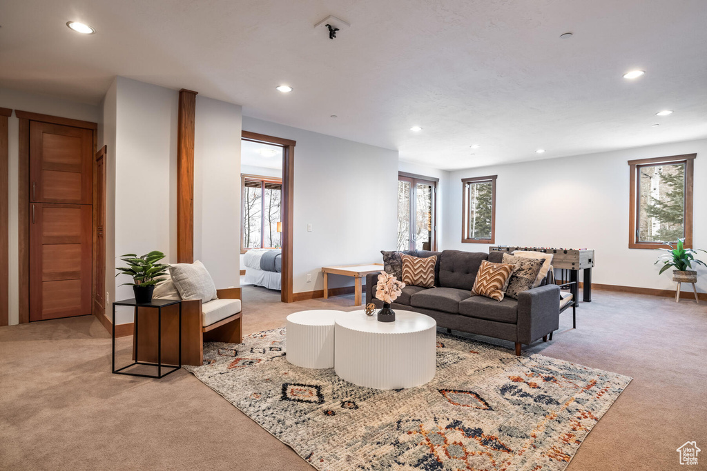 Living room featuring light carpet