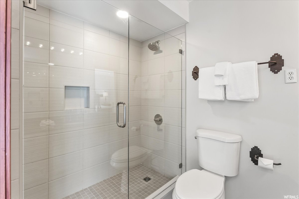 Bathroom with toilet and walk in shower