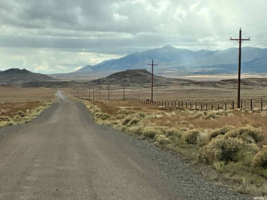 View of street with a rural view and a mountain view