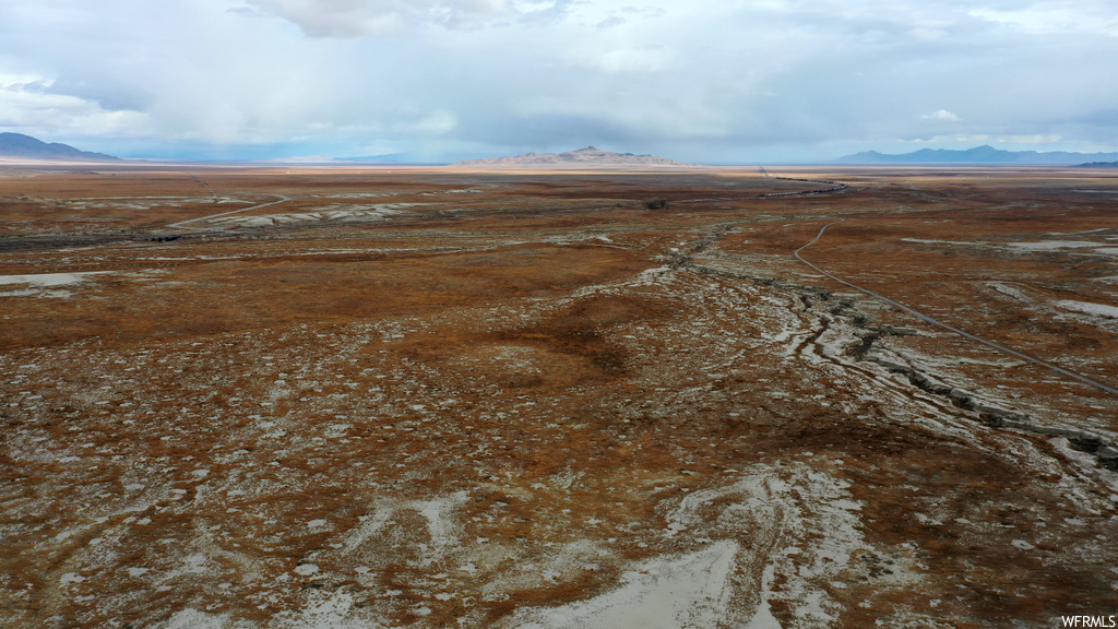 Aerial view featuring a rural view and a mountain view