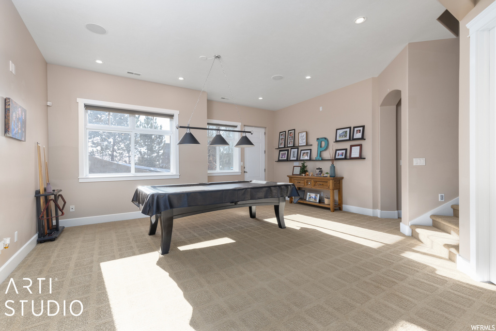 Playroom with light colored carpet and pool table