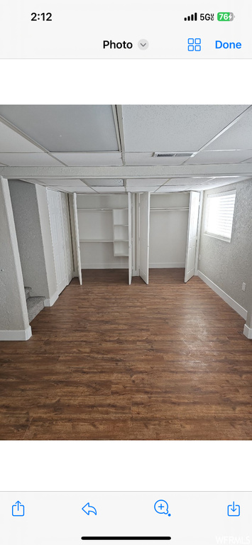 Interior space featuring dark wood-type flooring