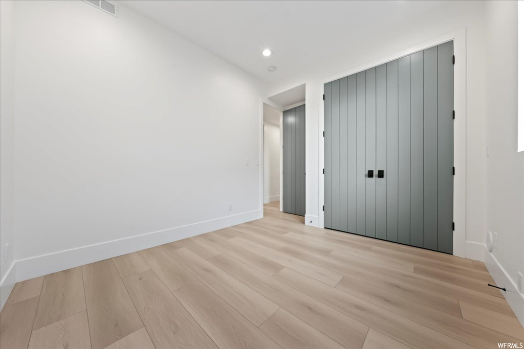 Empty room featuring light hardwood / wood-style flooring