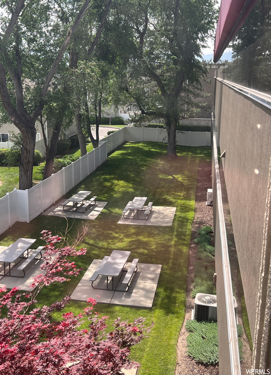 View of yard with a patio area and central air condition unit