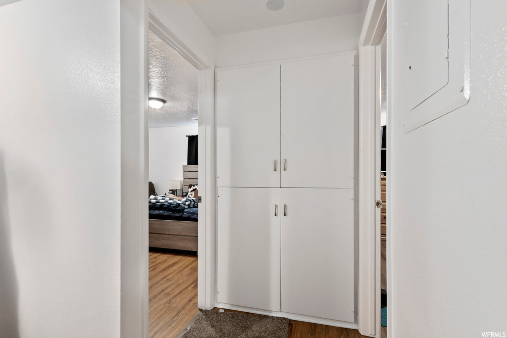 Corridor with wood-type flooring