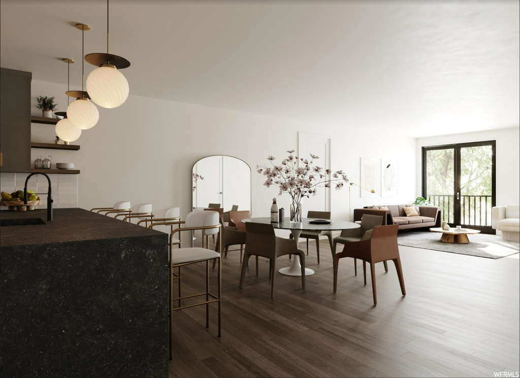 Dining area with dark hardwood / wood-style floors