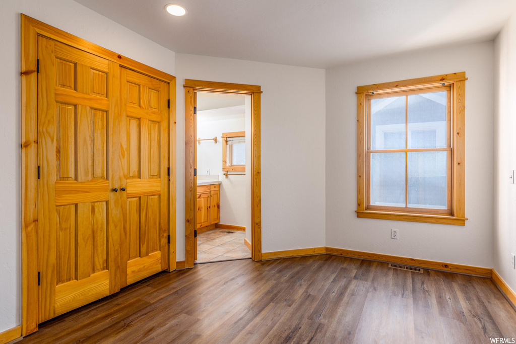 Unfurnished bedroom featuring light hardwood / wood-style floors