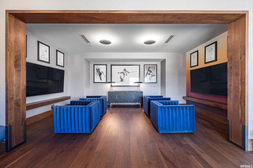 Living room with dark hardwood / wood-style flooring