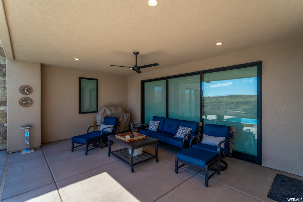 View of patio featuring ceiling fan and an outdoor hangout area