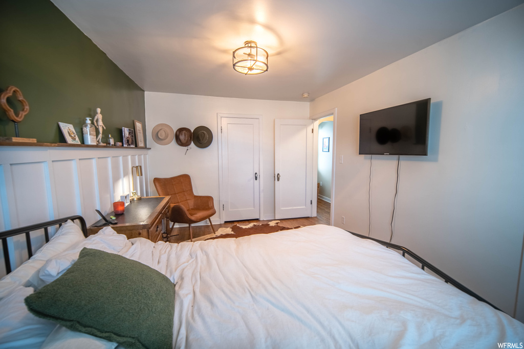 Bedroom with light hardwood / wood-style floors