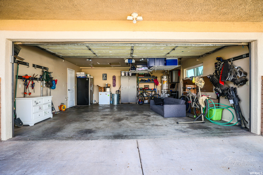 Garage with refrigerator and a garage door opener