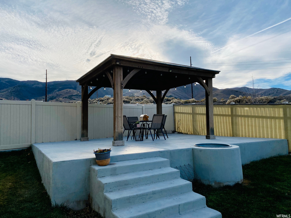 View of patio / terrace with a gazebo and a mountain view
