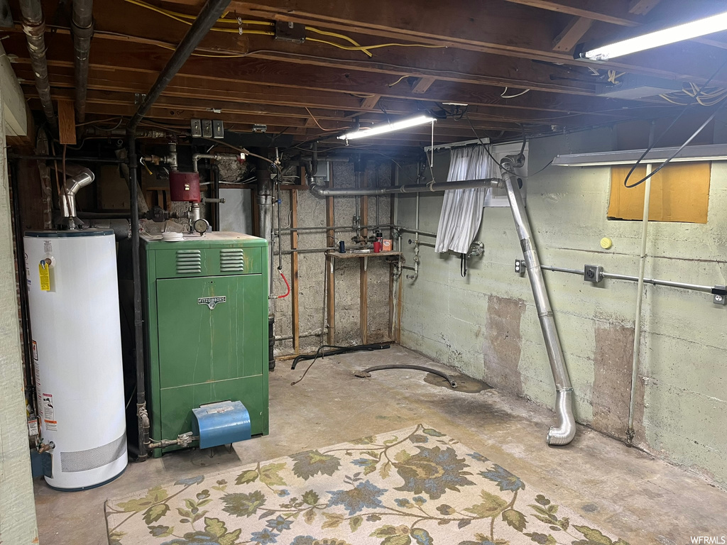 Basement featuring gas water heater and heating utilities