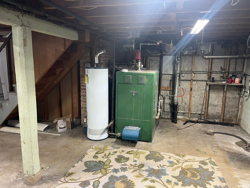 Utility room with gas water heater and heating utilities