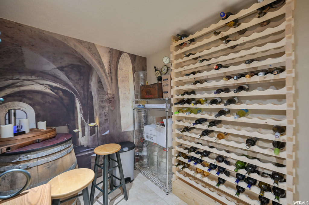 Wine cellar with light tile floors