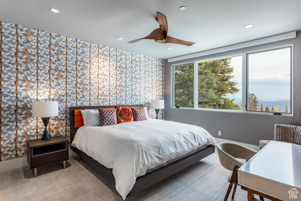 Bedroom featuring wallpapered walls, an accent wall, baseboards, ceiling fan, and recessed lighting