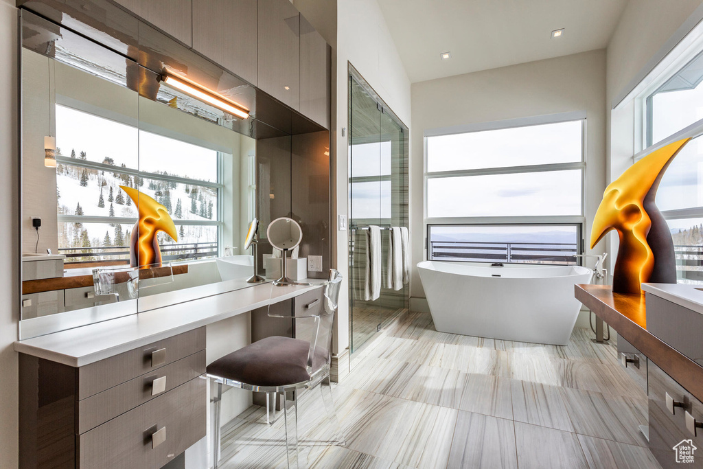 Full bathroom with a freestanding tub and vanity