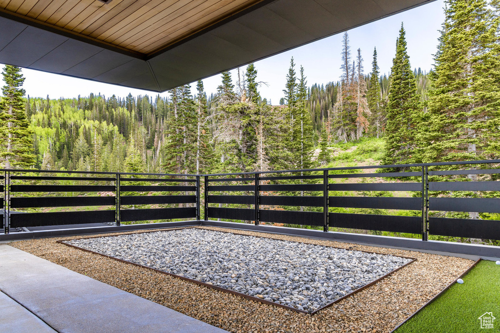 View of patio / terrace with a forest view